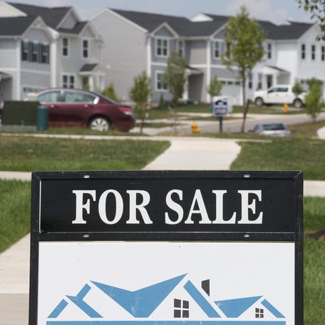 A for sale sign in front of a house in the Brookside Greens development in Norton near Akron, Ohio.