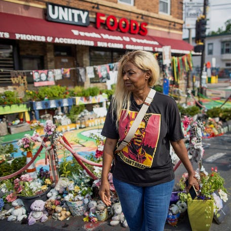 Angela Harrelson, George Floyd's aunt, walks along the memorial at the intersection of 38th and Chicago where he was murdered by a police officer in July 26, 2024.