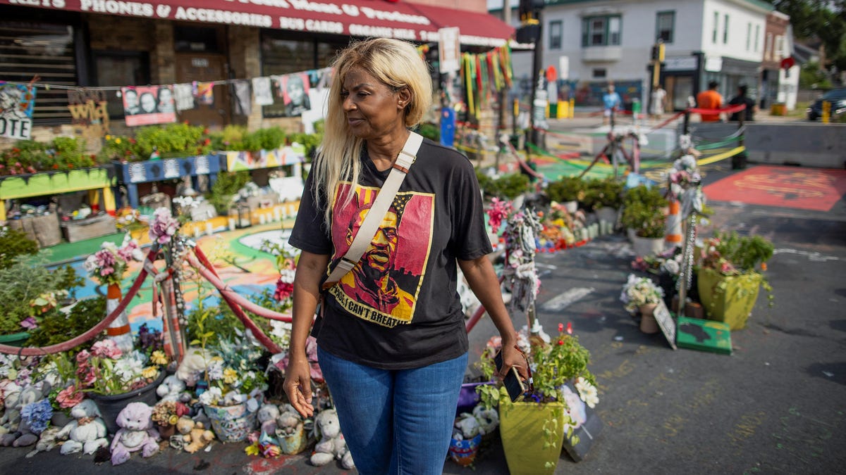 Angela Harrelson, George Floyd's aunt, walks along the memorial at the intersection of 38th and Chicago where he was murdered by a police officer in July 26, 2024.