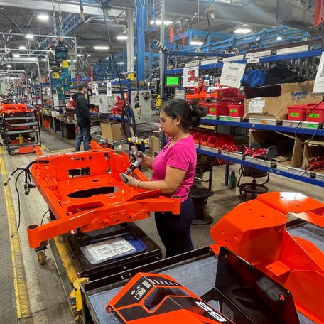 A worker installs parts at the start of an assembly line at an Ariens factory in Brillion, Wisconsin, U.S., March 5, 2025. REUTERS/Tim Aeppel