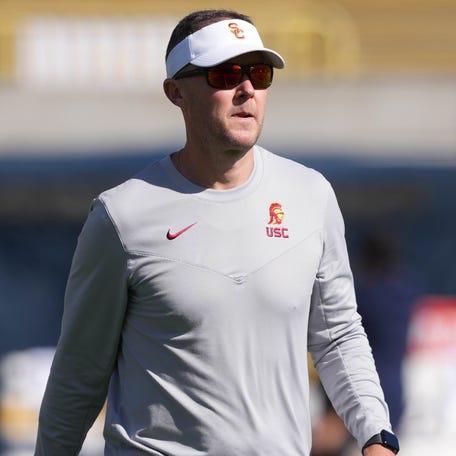 Southern California coach Lincoln Riley walks on the field before his team's 2023 game at California Memorial Stadium.