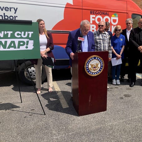 Regional Food Bank of Northeastern NY's Felicia Kalan, Sen. Chuck Schumer, Crist Orchards' Jeff Crist, Deacon Jack Seymour Food Pantry's Paul & Linda Zalanowski, Assemblyman Chris Eachus, Rev. Fernando Hernandez, Rev. Christy Miller, Bishop Jeffrey Woody decry SNAP cut.