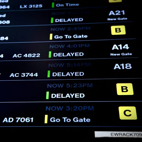 A screen displaying the flight status is seen at Newark Liberty International Airport in Newark, New Jersey on May 7, 2025.