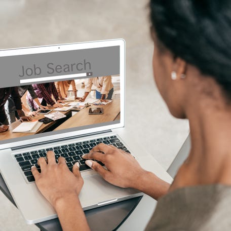 Woman looking at a job search portal online.