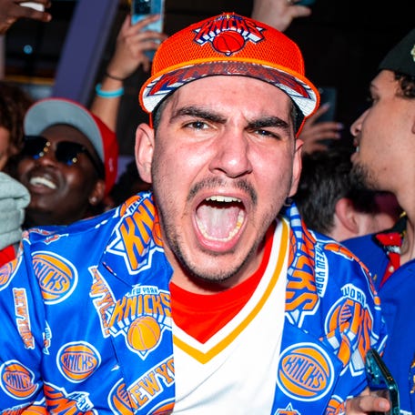 New York fans celebrate outside Madison Square Garden after the Knicks advanced to the Eastern Conference Finals for the first time since 2000.