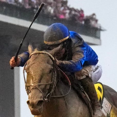 Sovereignty, with Junior Alvarado up, left, wins the 151st Kentucky Derby on May 3. Alvarado was fined $62,000 and issued a two-day suspension for violating the "crop rule."