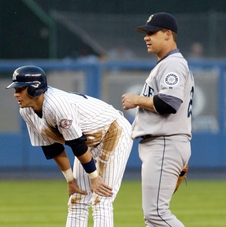 Aaron Boone with the Yankees and Bret Boone with the Mariners in 2003.