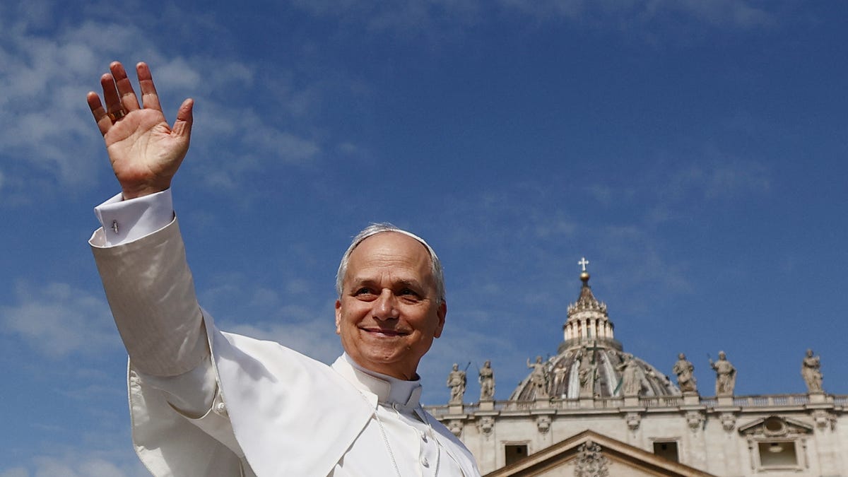 Pope Leo XIV arrives on the popemobile for his inaugural Mass at the Vatican, May 18, 2025.