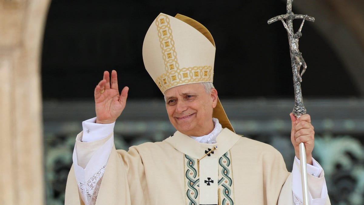 Pope Leo XIV gestures at the end of his inaugural Mass in Saint Peter's Square, at the Vatican May 18, 2025.