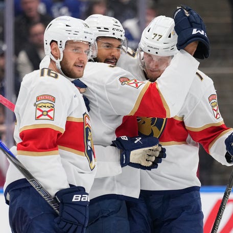 Florida Panthers defenseman Seth Jones (3) celebrates his goal against the Toronto Maple Leafs with teammates Aleksander Barkov (16) and defenseman Niko Mikkola (77) during the second period of Game 7.