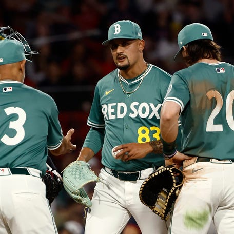Alex Cora comes to the mound to take the ball from Brennan Bernardino in the ninth inning on May 16.