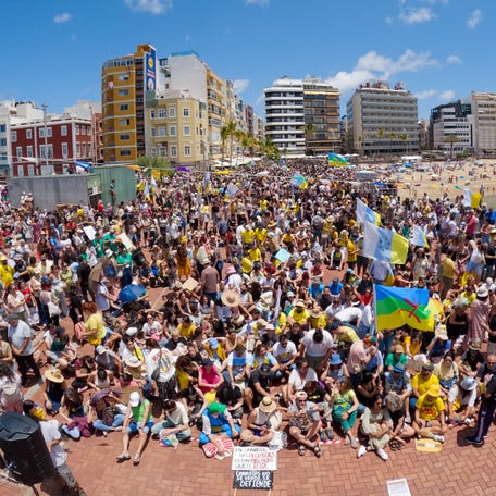 People gather during a demonstration calling for a change in the tourism model in the Canary Islands, in Las Palmas de Gran Canaria, Spain, on May 18, 2025.