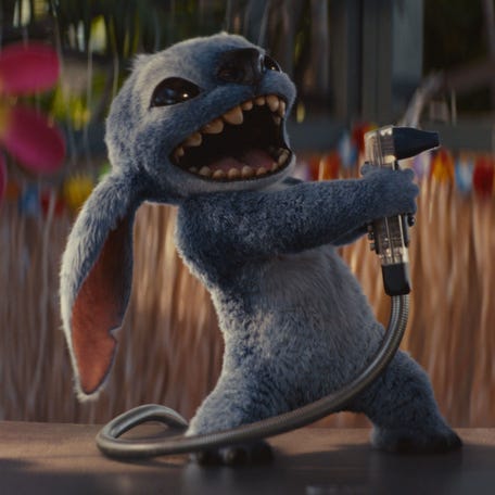 Stitch gets a little crazy with the soda gun at a Hawaiian bar in Disney's live-action "Lilo & Stitch."