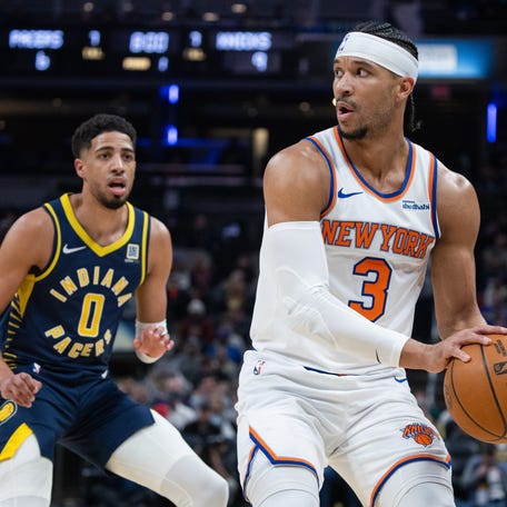 New York Knicks guard Josh Hart (3) holds the ball while Indiana Pacers guard Tyrese Haliburton (0) defends in the first half at Gainbridge Fieldhouse.