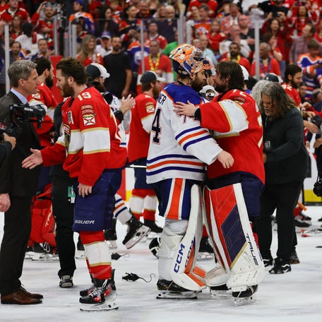 Edmonton Oilers goaltender Stuart Skinner (74) and Florida Panthers goaltender Sergei Bobrovsky (72) shake hands after the Panthers win in Game 7 of the 2024 Stanley Cup Final.