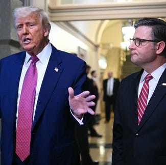 Donald Trump and US Speaker of the House Mike Johnson (R-LA) speak to the press after a House GOP Conference Meeting at the US Capitol in Washington, DC on May 20, 2025.