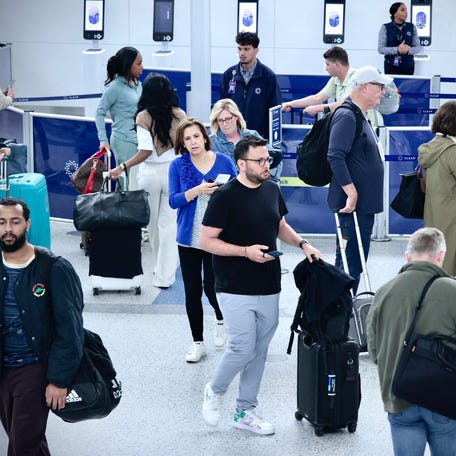 Passengers arrive at Newark Liberty International Airport in Newark, New Jersey on May 7, 2025.