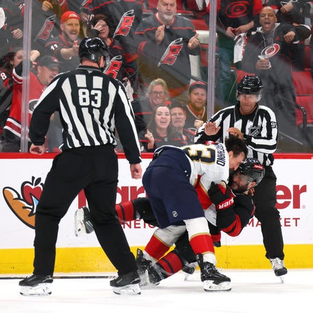 Brad Marchand goes after Shayne Gostisbehere during the third period of Game 1.