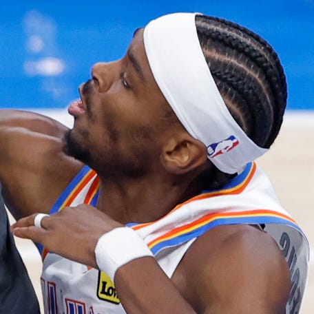 Anthony Edwards and Shai Gilgeous-Alexander fight for a rebound in the first quarter during Game 1 of the Western Conference finals.