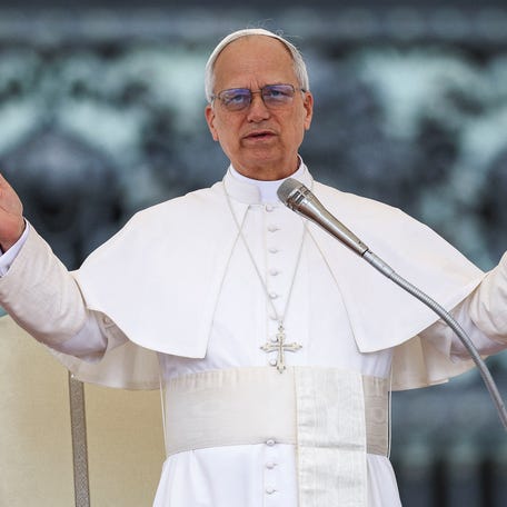 Pope Leo XIV gestures as he holds his first general audience in St. Peter's Square, at the Vatican, May 21, 2025.