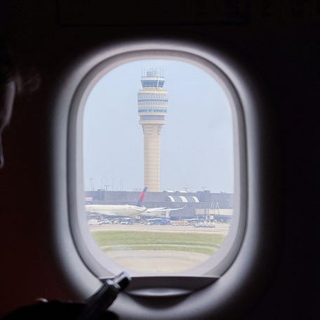 The air traffic control tower is seen from inside of the plane at Hartsfield-Jackson Atlanta International Airport, in Atlanta, Georgia, U.S., May 15, 2025. REUTERS/Megan Varner