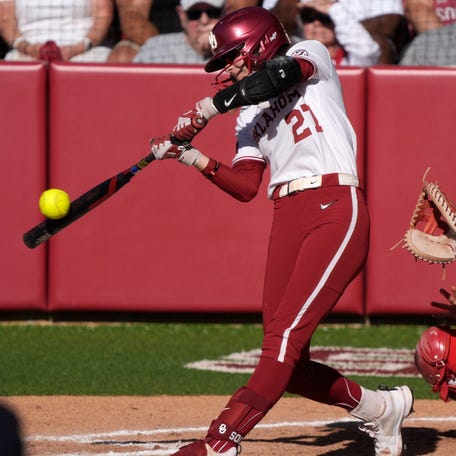 Oklahoma outfielder Hannah Coor (27) hits single during the team's game against Boston University in the 2025 NCAA softball tournament at Love's Field in Norman, Okla., Friday, May 16, 2025.