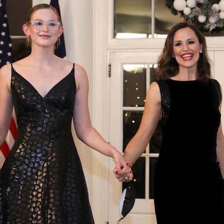 Jennifer Garner, right, and her daughter Violet Affleck arrive for a state dinner in honor of French President Emmanuel Macron at the White House in Washington, D.C., on Dec. 1, 2022.