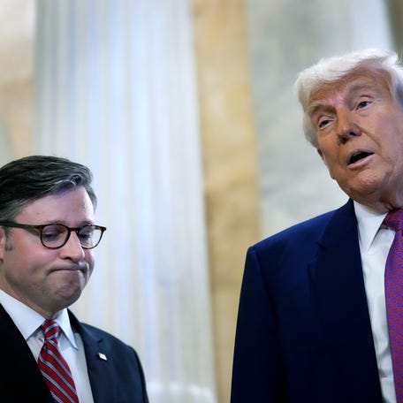 With Speaker of the House Mike Johnson (R-LA) by his side President Donald Trump speaks to the press following a House Republican meeting at the U.S. Capitol on May 20, 2025 in Washington, DC. Trump will joined conservative House lawmakers to help push through their budget bill after it advanced through the House Budget Committee on Sunday evening.