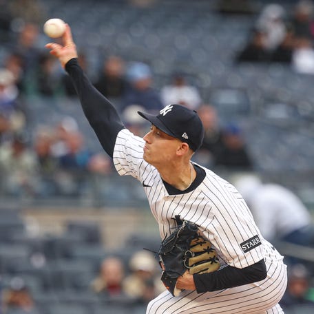 May 22, 2025; Bronx, New York, USA; New York Yankees relief pitcher Luke Weaver (30) delivers a pitch during the ninth inning against the Texas Rangers at Yankee Stadium. Mandatory Credit: Vincent Carchietta-Imagn Images