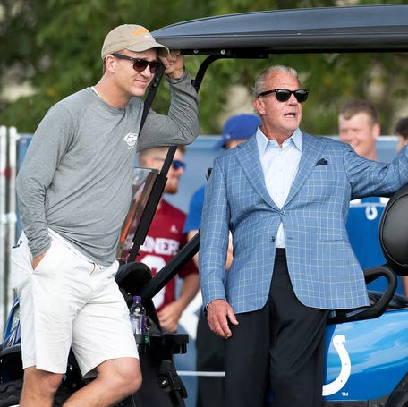 Peyton Manning talks to Indianapolis Colts owner Jim Irsay during a joint practice against the Cleveland Browns on Aug. 15, 2019.