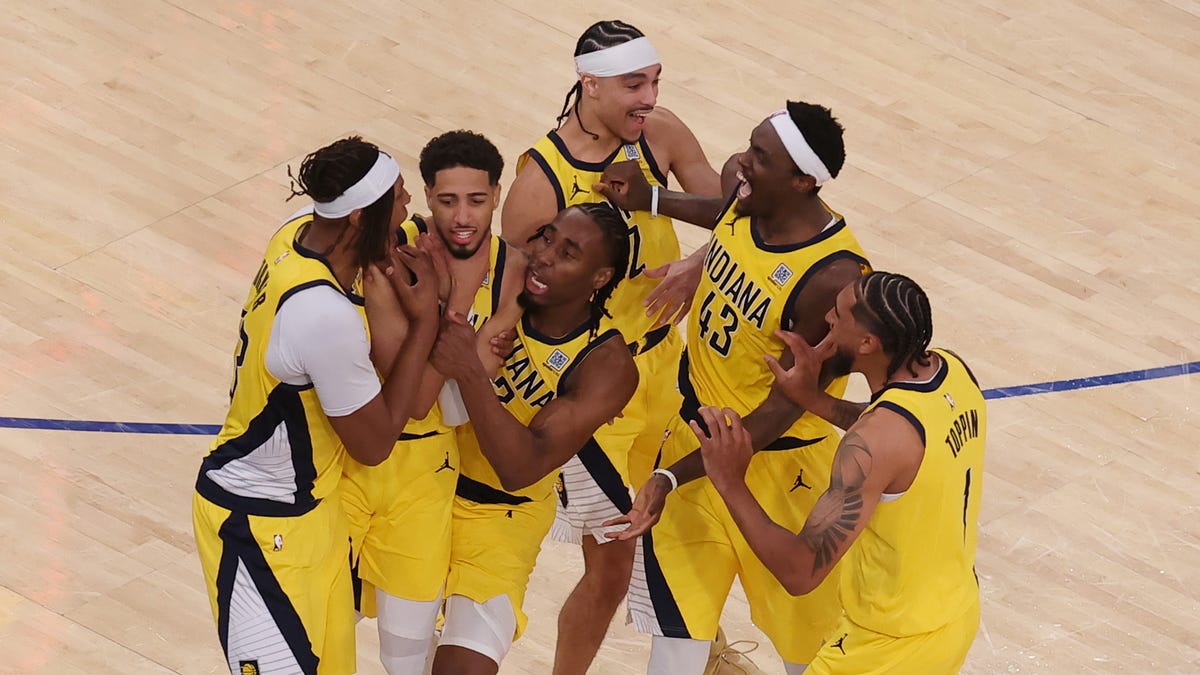 Tyrese Haliburton, second from left, celebrates with teammates after forcing overtime on a 2-point buzzer-beater in Game 1.