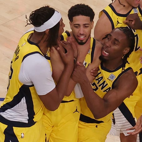 Tyrese Haliburton, second from left, celebrates with teammates after forcing overtime on a 2-point buzzer-beater in Game 1.
