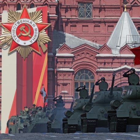 Russian armored vehicles, including T-34 Soviet-era tanks, drive during a military parade marking the 80th anniversary of the victory over Nazi Germany in World War Two, in Red Square in central Moscow, on May 9, 2025.