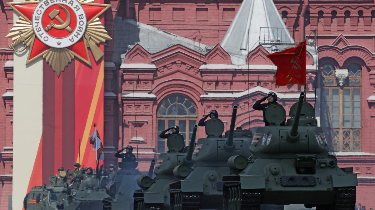 Russian armored vehicles, including T-34 Soviet-era tanks, drive during a military parade marking the 80th anniversary of the victory over Nazi Germany in World War Two, in Red Square in central Moscow, on May 9, 2025.