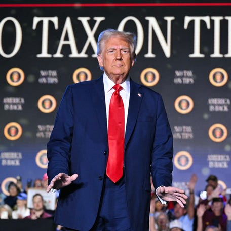 US President Donald Trump arrives to speak on his policy to end tax on tips in Las Vegas, Nevada, on January 25, 2025. After visits to disaster sites in North Carolina and California, the Vegas stop is more of a feel-good victory lap, as he lays out his plans to exclude tips from federal taxes -- an enormously popular move in a city built on the hospitality industry.