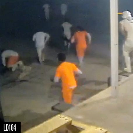 A screen grab taken from CCTV video shows inmates running through the loading dock at the Orleans Parish Justice Center in New Orleans, Louisiana, on May 16, 2025.