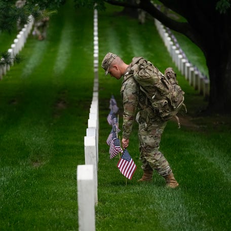 Ahead of Memorial Day, over one thousand service members from the 3d U.S. Infantry Regiment ("The Old Guard"), the U.S. Marine Corps Ceremonial and Guard Company, U.S. Navy Ceremonial Guard, U.S Air Force Honor Guard, and the U.S. Coast Guard Ceremonial Honor Guard, participate in the annual Flags-In Ceremony at Arlington National Cemetery on Thursday, May 22, 2025. American flags are placed at headstones to honor those laid to rest at Arlington National Cemetery.
