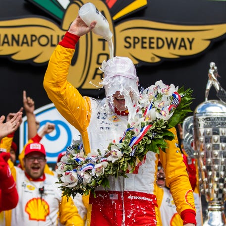IndyCar Series driver Josef Newgarden celebrates with milk after winning the Indianapolis 500 at Indianapolis Motor Speedway on May 28, 2023