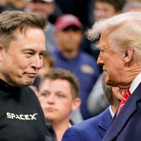 Tesla CEO Elon Musk greets U.S. President Donald Trump as they attend the NCAA men's wrestling championships in Philadelphia, Pennsylvania, U.S., March 22, 2025. Trump appointed Musk to lead the Department of Government Efficiency.