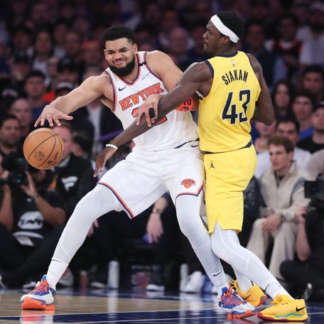 New York Knicks center Karl-Anthony Towns (32) controls the ball against Indiana Pacers forward Pascal Siakam (43) in the second quarter of Game 2.