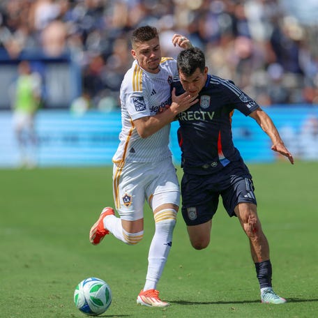 San Diego FC forward Chucky Lozano (11) challenges LA Galaxy forward Gabriel Pec (11) during the second half at Snapdragon Stadium in San Diego, California on May 24, 2025.