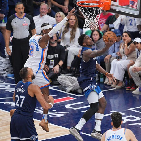 Minnesota Timberwolves guard Anthony Edwards (5) shoots the ball past Oklahoma City Thunder guard Shai Gilgeous-Alexander (2) during Game 3.