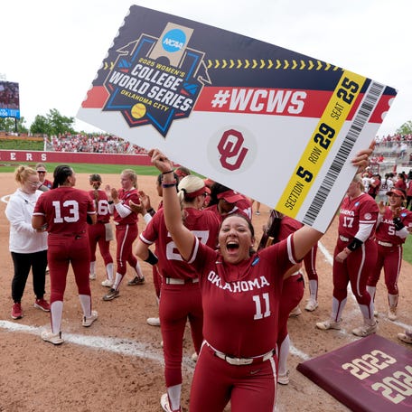 Oklahoma pitcher Kierston Deal (11) celebrates after the Sooners punched their ticket to the Women's College World Series.