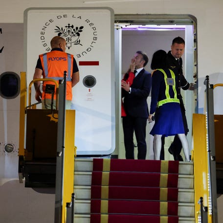 France's President Emmanuel Macron was seemingly pushed in the face by his wife Brigitte Macron as the couple arrived in Vietnam to begin a tour of Southeast Asia, at Noi Bai International Airport, in Hanoi, Vietnam on May 25, 2025