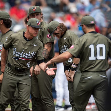 Vanderbilt coach Tim Corbin (4) shakes hands with his players during introductions before his team plays Mississippi in the SEC baseball tournament championship game at Hoover Met in Birmingham, Ala., on Sunday, May 25, 2025.