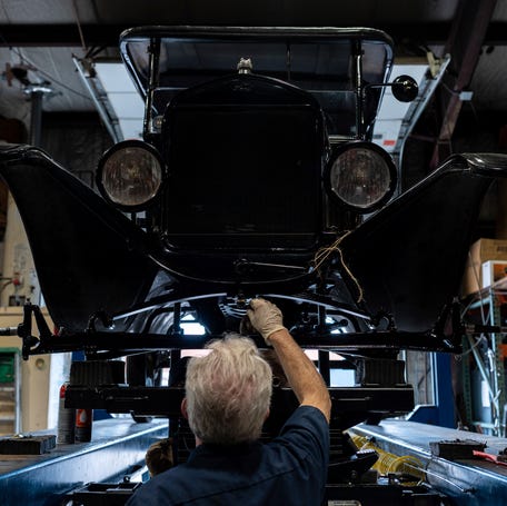 Todd Storrs, 61, a Ford Model T mechanic at The Henry Ford, works on a Model T inside the Antique Vehicle Garage Facility in Dearborn on Tuesday, May 27, 2025. Storrs joined the team a year and a half ago and is part of a small crew responsible for maintaining the museum's fleet of antique vehicles.