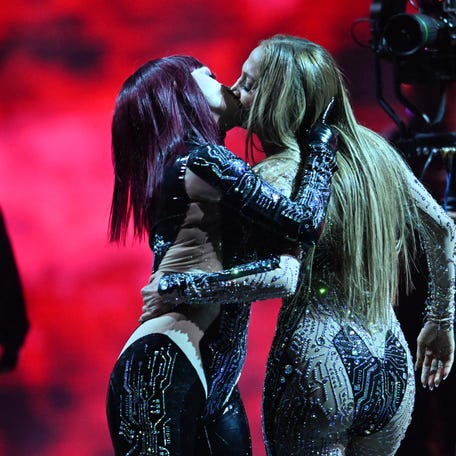 Host Jennifer Lopez performs onstage during the 51st American Music Awards.