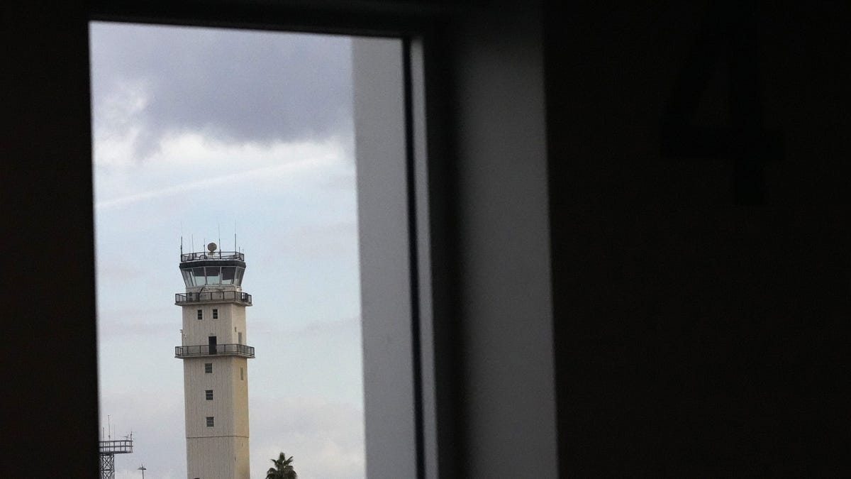 The old air traffic control tower can be seen from Phoenix-Mesa Gateway Airport new south terminal concourse window on Jan. 24, 2024.