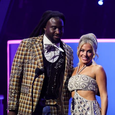 Shaboozey and Megan Moroney speak onstage during the 2025 American Music Awards at BleauLive Theater at Fontainebleau Las Vegas on May 26, 2025, in Las Vegas.