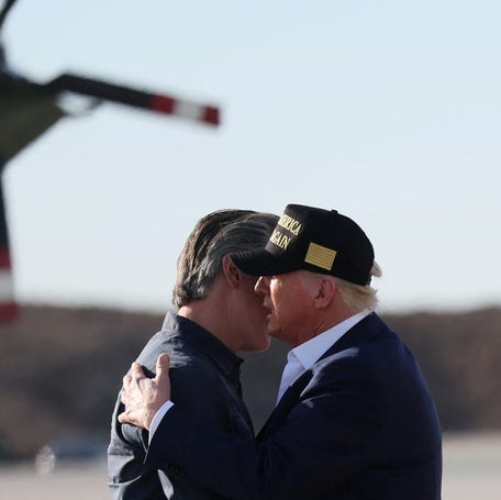 U.S. President Donald Trump greets Governor of California Gavin Newsom as he arrives to tour areas impacted or destroyed by the southern California wildfires, at Los Angeles International Airport in Los Angeles on January 24, 2025.